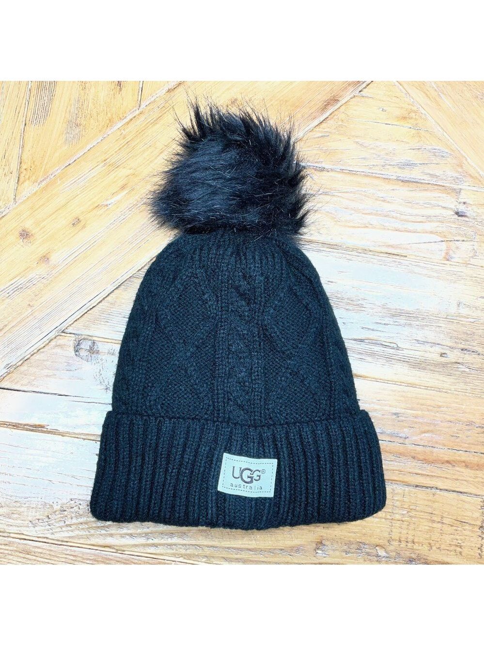 UGG Cable Knit Black Beanie with a faux fur Pom on top 🖤